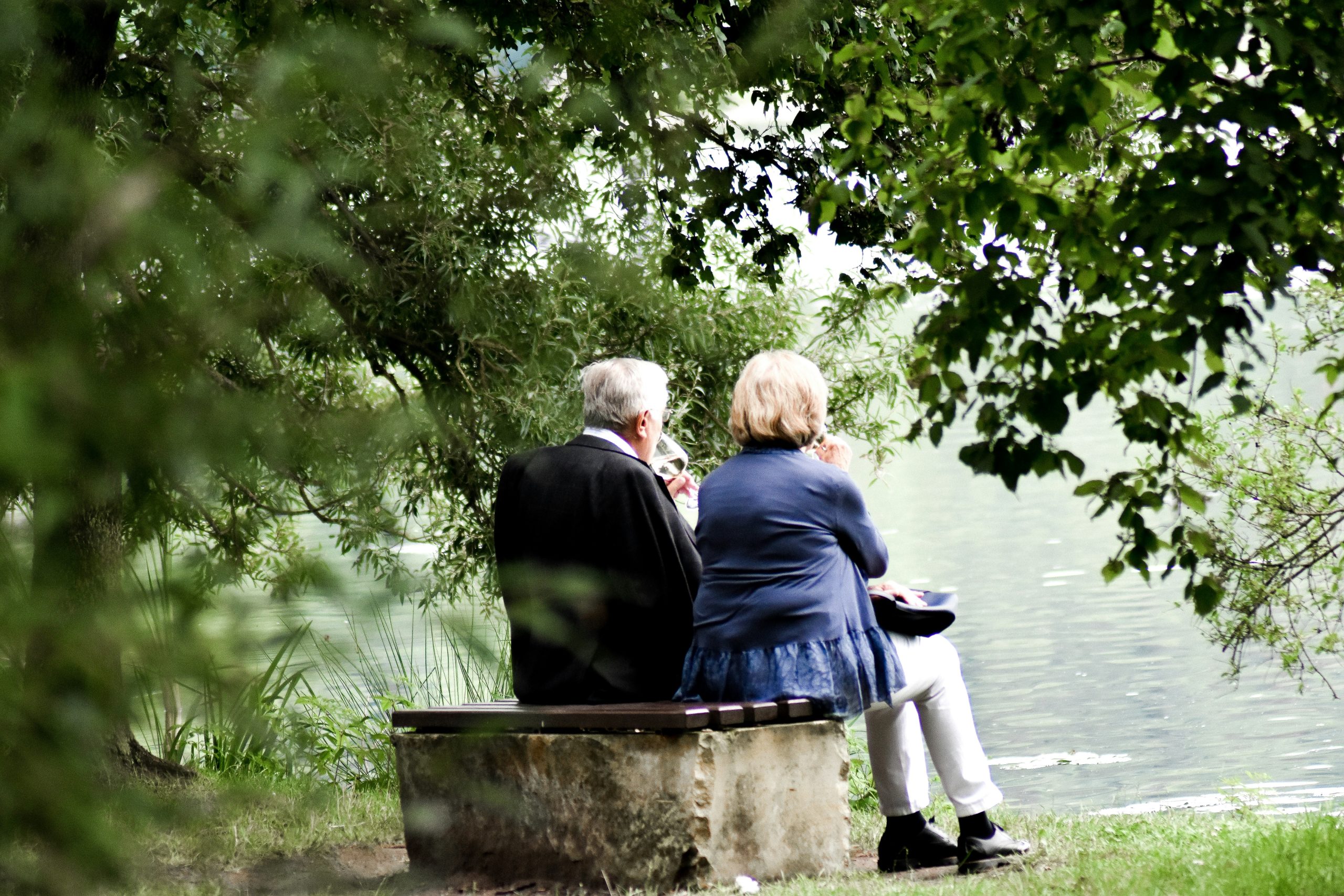 Senior couple relaxing by a lake